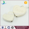 heart shape ceramic decoration with love relief